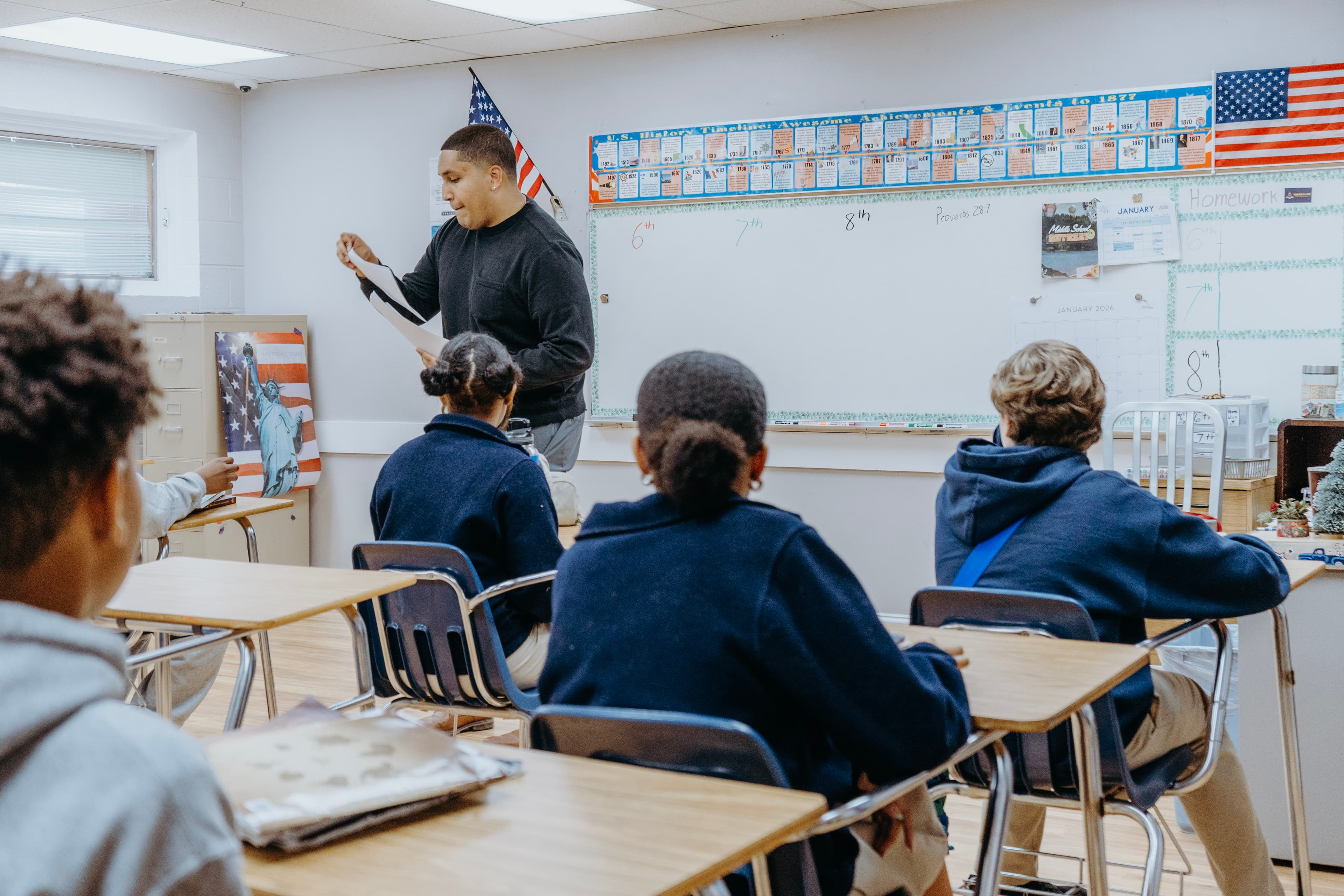 Students focused on their work in a clean, structured classroom