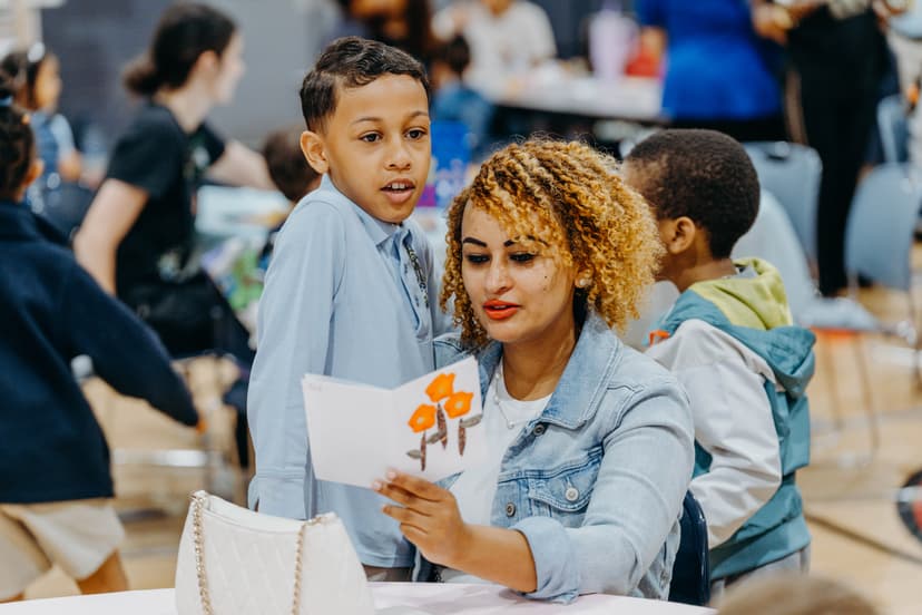 Parent and child reading together at home